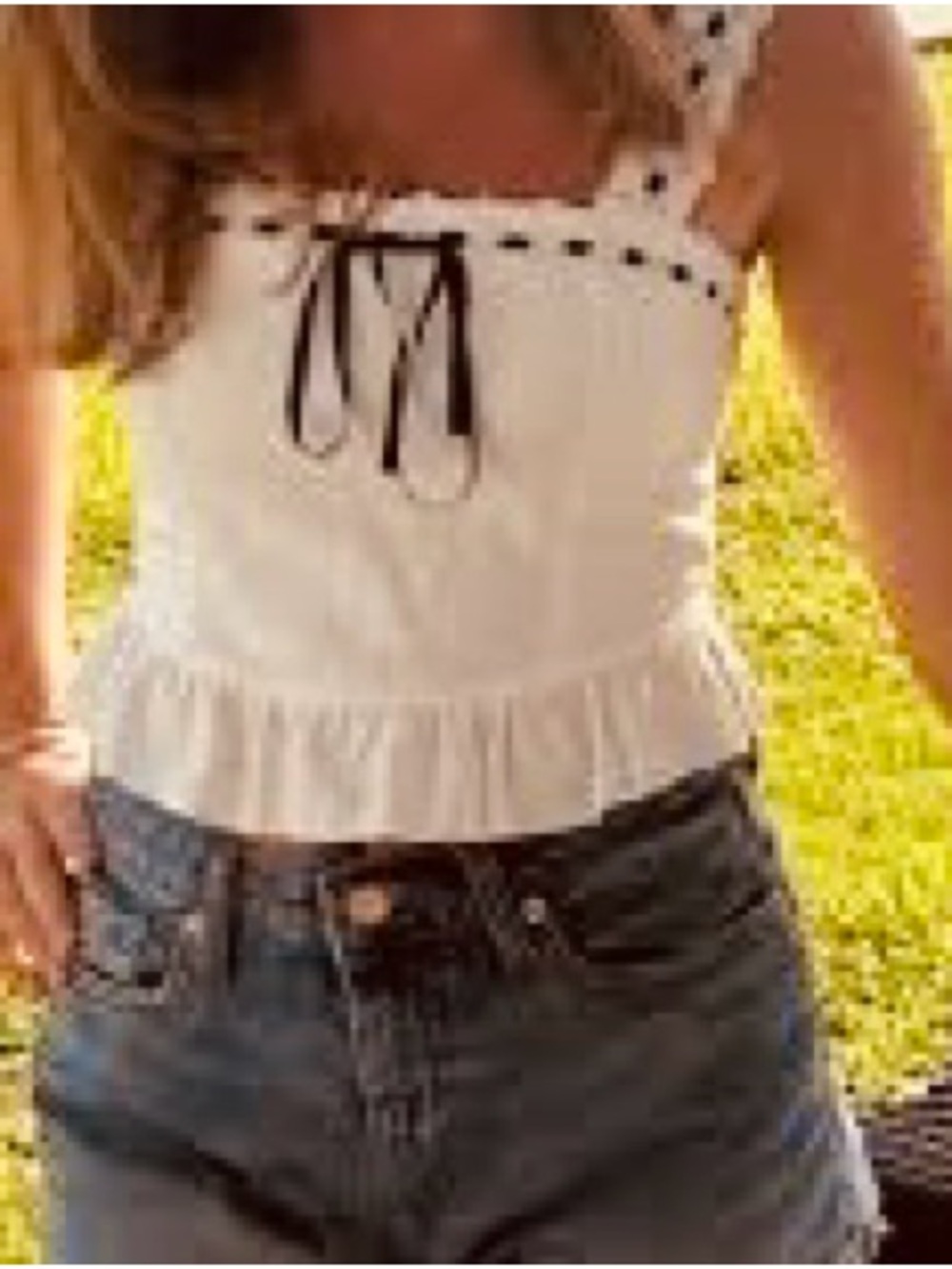 a Kirious Los Angeles Chic White Lace Trim Tank Top.